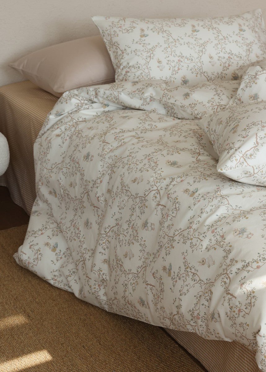 Verbena Botanical Cotton Bedding Set – overhead angle of ivory printed pillows and duvet - Roomden