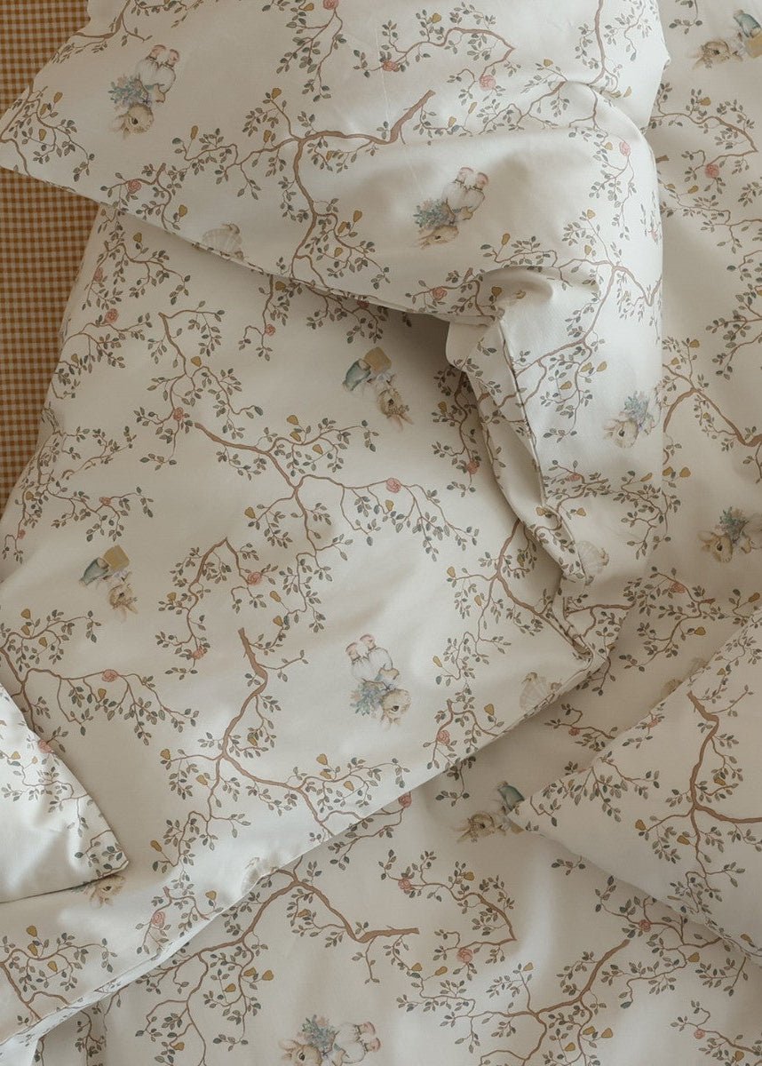 Verbena Botanical Cotton Bedding Set – close view of small rabbits and leafy branches on ivory cotton - Roomden