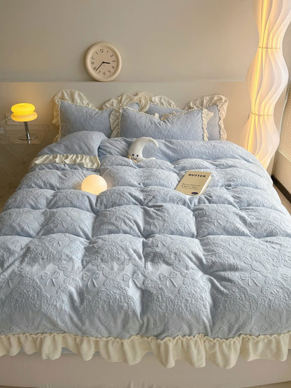 Romantic light blue flannel bedding with cream ruffled pillowcases and soft lighting - RoomDen