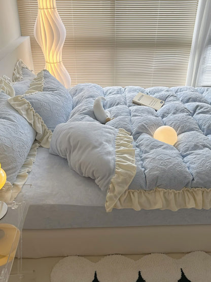 Side view of light blue fleece bedding with layered cream ruffles - RoomDen