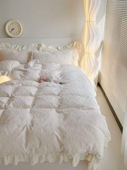 Romantic cream white bedding set with ruffled edges and warm glowing light - RoomDen