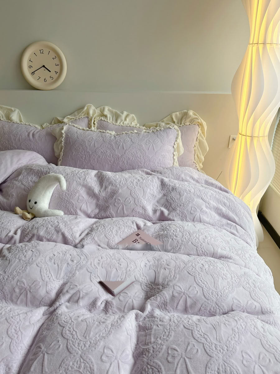 Elegant lavender bedding set with embossed floral details and soft natural light - RoomDen