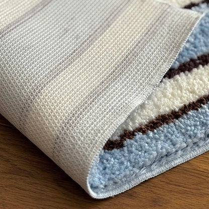 Detail shot of non-slip TPR backing on the blue and white rug - RoomDen