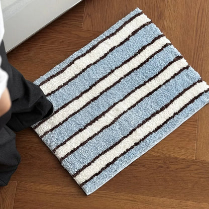 Perspective shot of blue striped runner rug with feet for scale - RoomDen