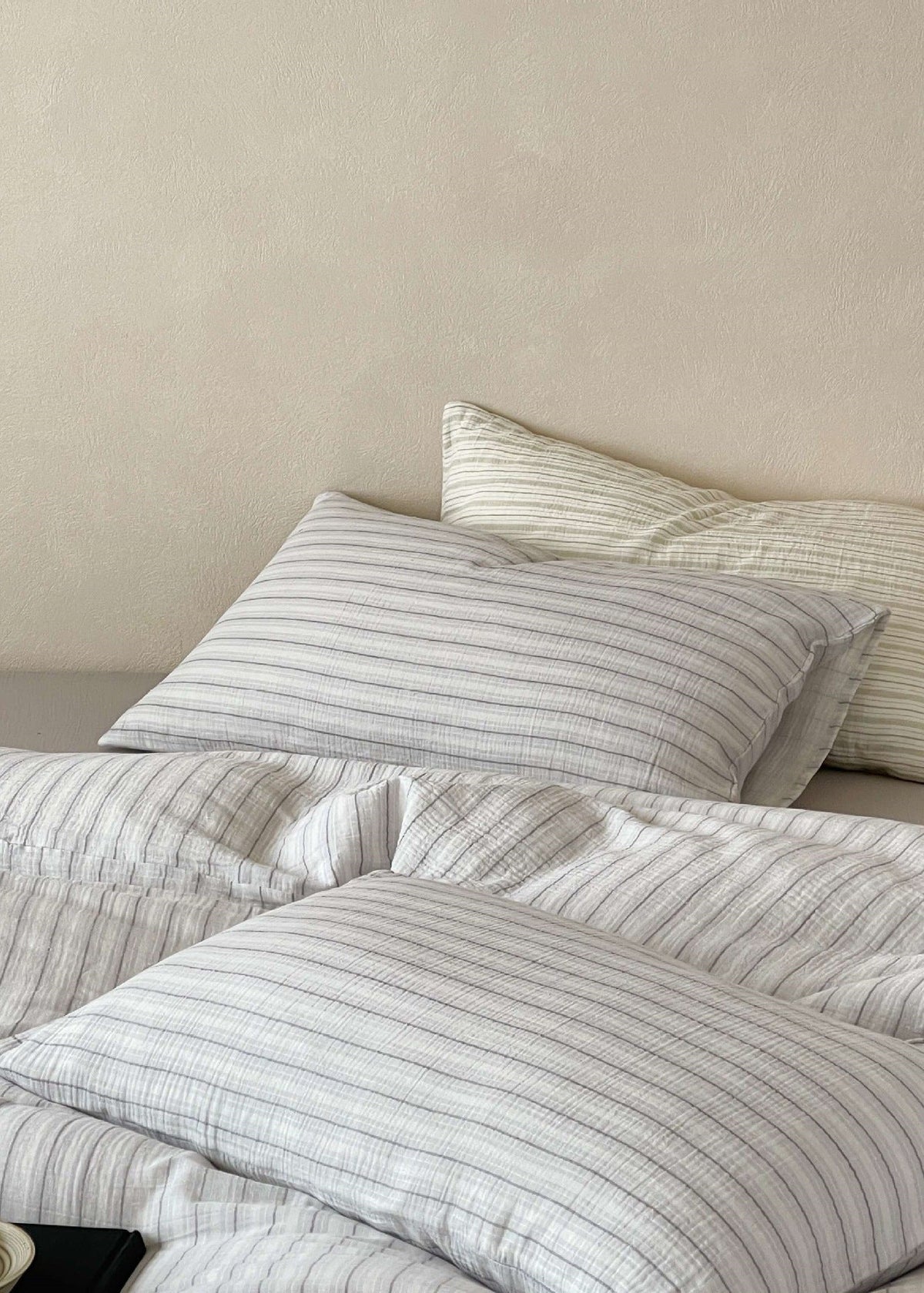 Halden Striped Cotton Double Gauze Bedding Set – close view of grey pillows and the striped cotton gauze - Roomden