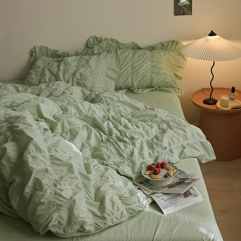 Odessa Ruffled Cotton Blend Bedding Set – mint-green ruffled pillows above folds of the duvet - Roomden