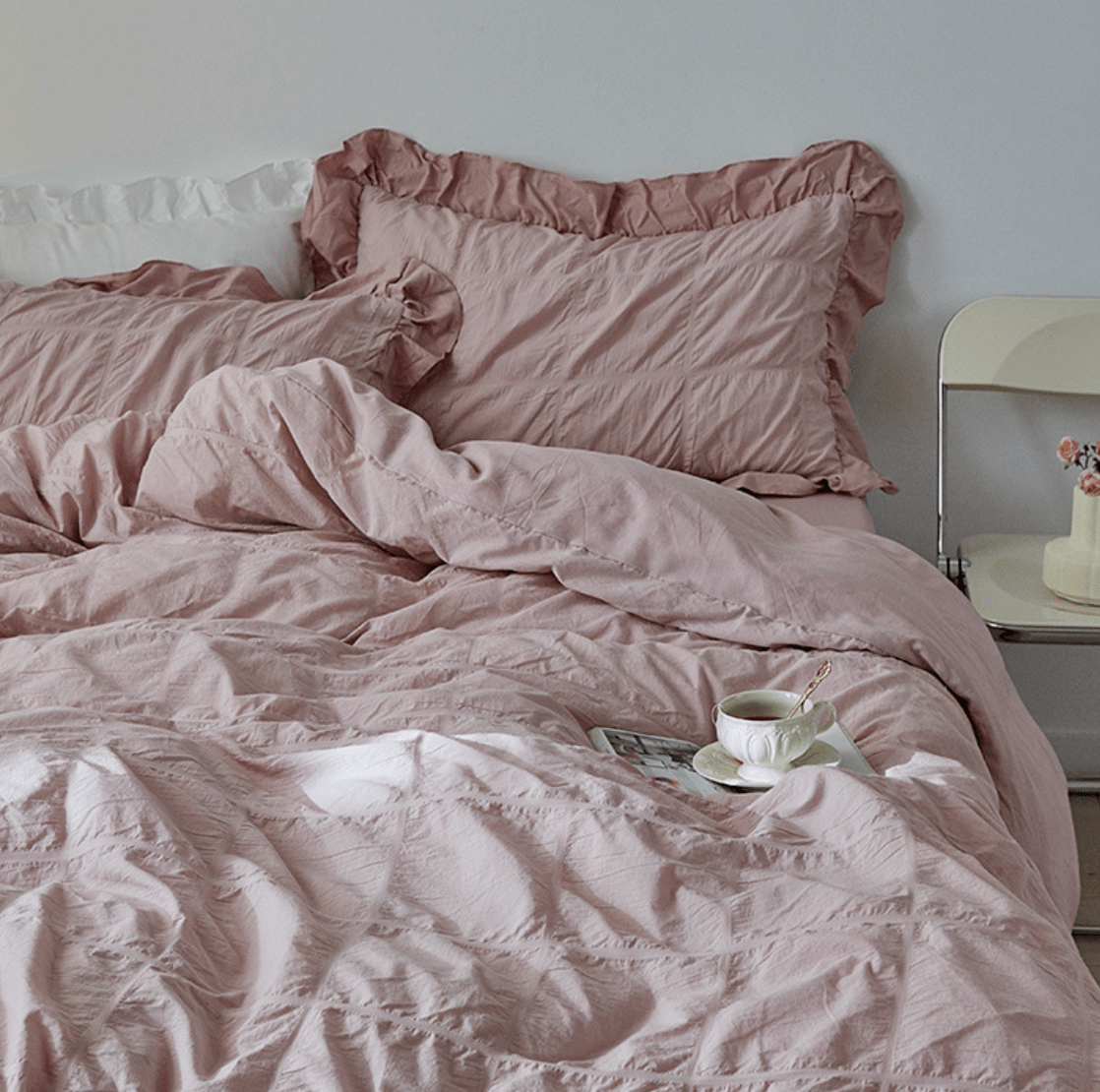 Odessa Ruffled Cotton Blend Bedding Set – pink ruffled pillows and duvet viewed from the side - Roomden