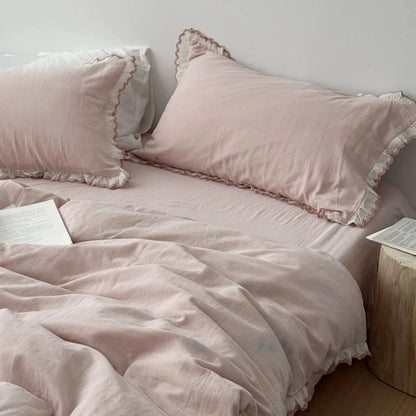 Full view of the Soft Embroidered Lace Ruffle Cotton Bedding Set in a delicate dusty rose pink.