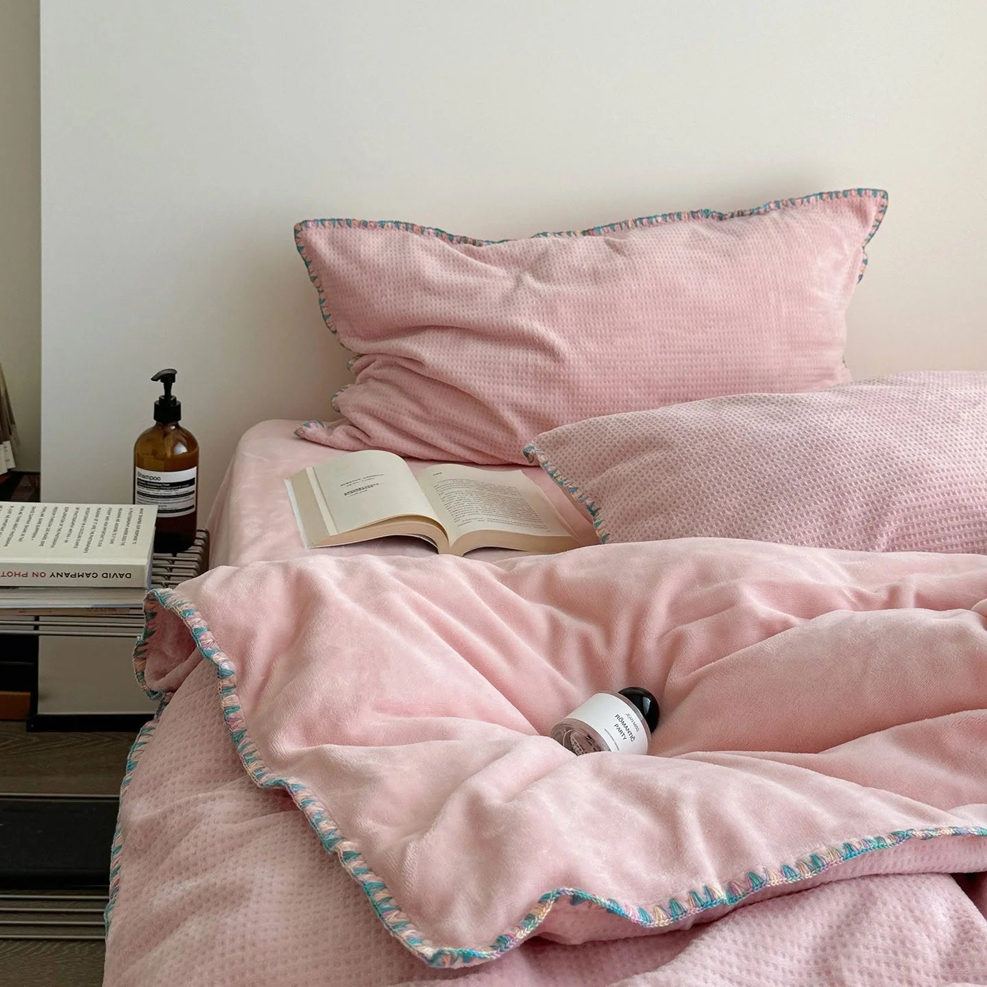 Lifestyle image showing the full Blush Pink Waffle Fleece Bedding Set in a bright, airy room.