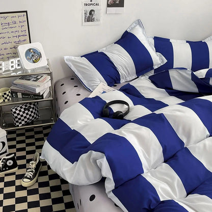 Detailed shot of the corner of the bed with the Blue & White Striped Bedding Set, showing the contrast and pattern - RoomDen