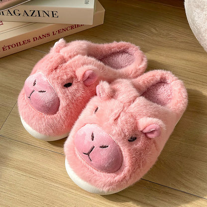 Blush Pink Capybara soft plush slippers on wooden floor RoomDen