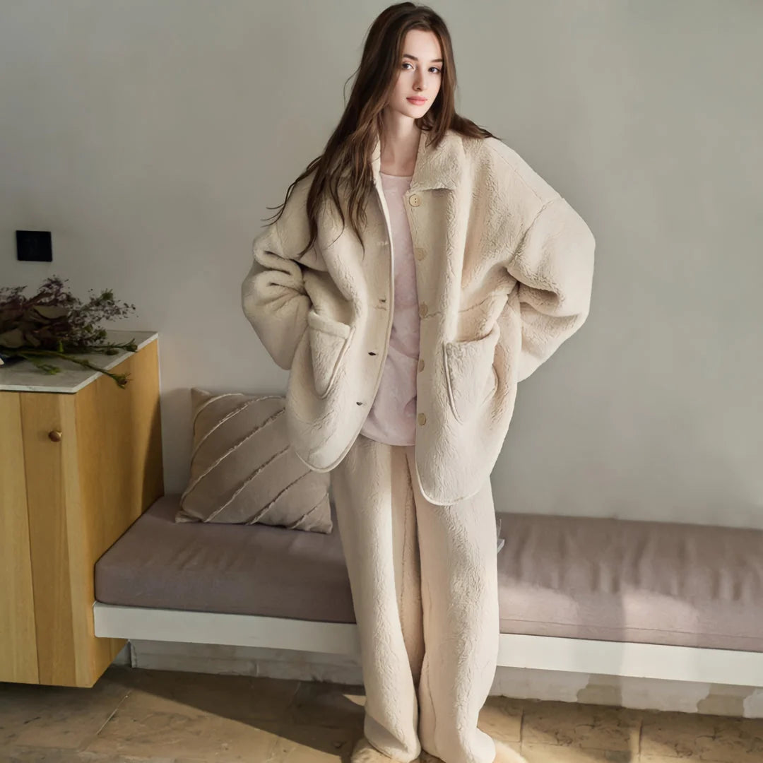 Model wearing the full Creamy Beige Plush Sherpa Fleece Pajama Set in a softly lit room - RoomDen.