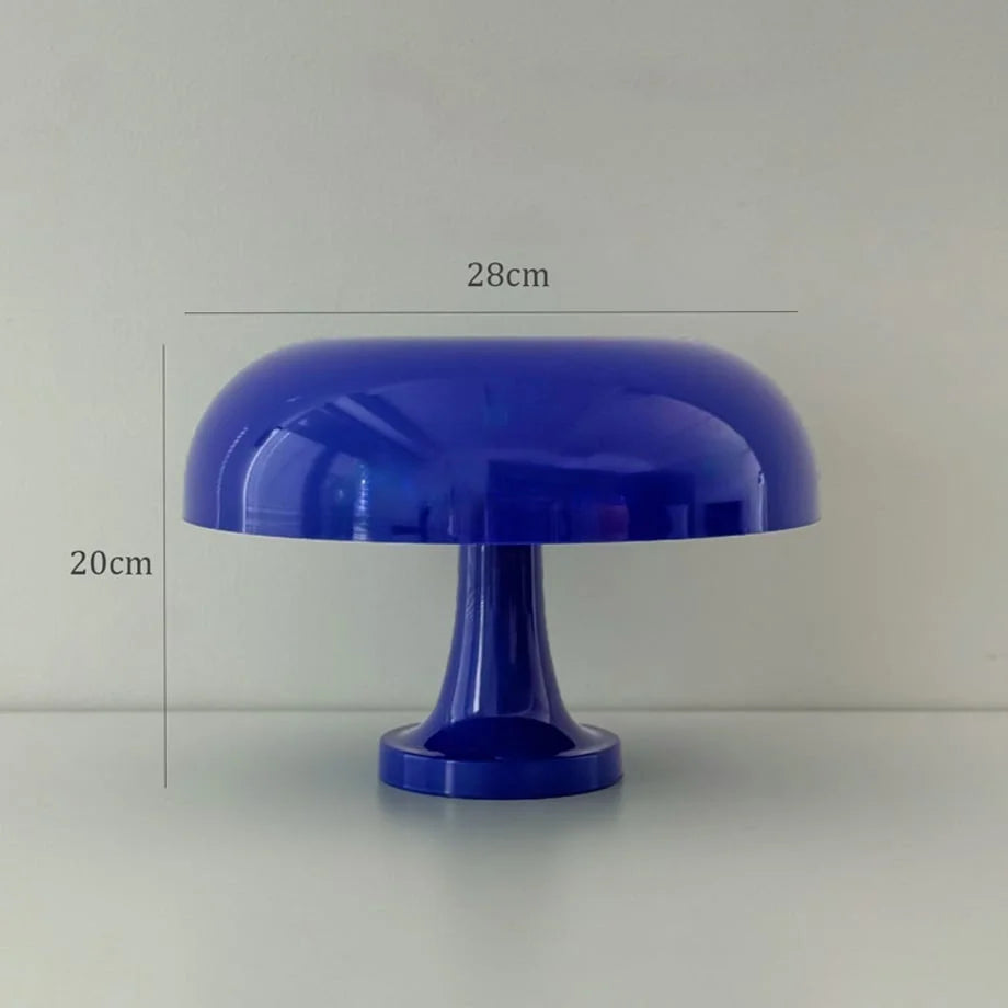 The cobalt blue mushroom lamp shown against a plain background to highlight its shape and size - RoomDen.