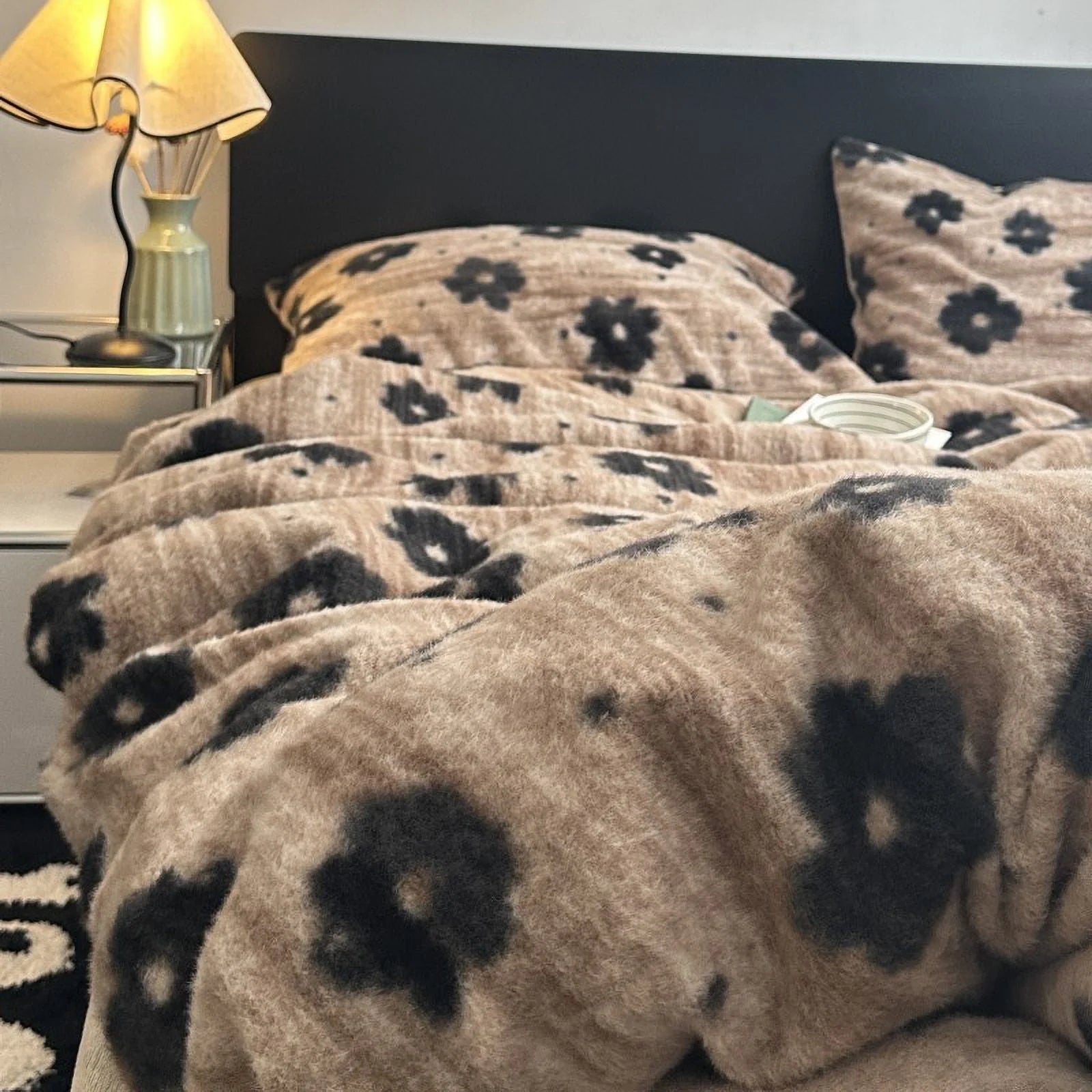 A detailed shot of the fluffy duvet cover from the retro floral bedding set, with a warm lamp in the background enhancing the cozy atmosphere. - RoomDen