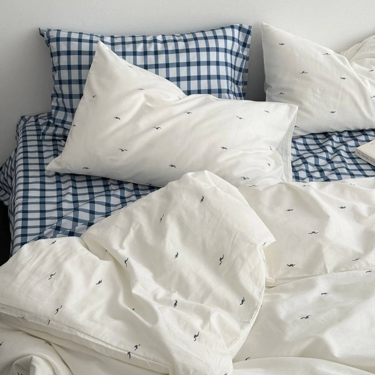 Another full view of the Gingham & Seagull Embroidered Washed Cotton Bedding Set on a neatly made bed - RoomDen