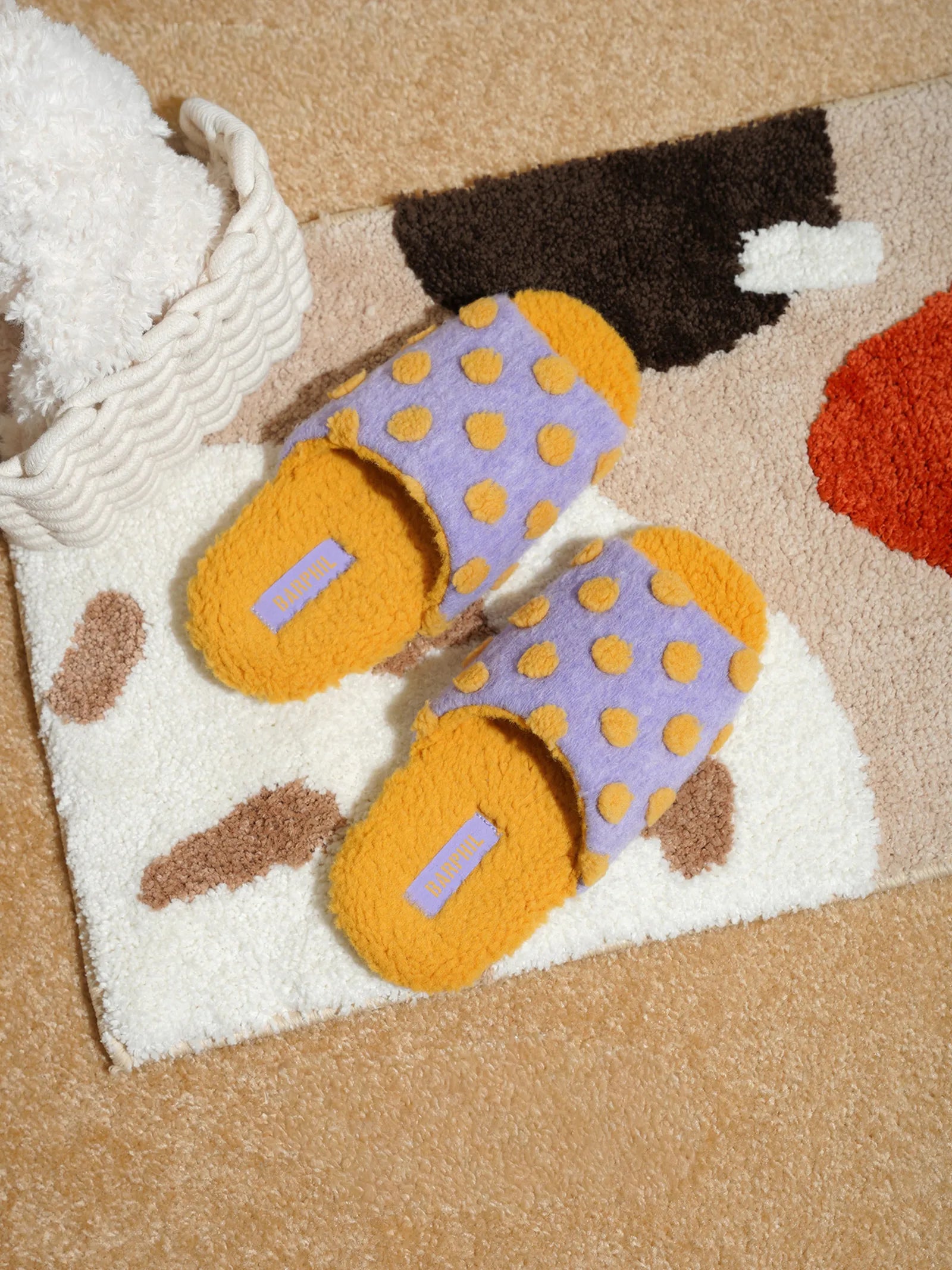Top down view of Purple Polka Dot Fuzzy Slides on rug - RoomDen