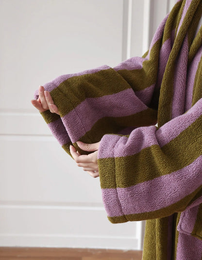 Detail shot of the wide sleeve cuff showing the plush loop texture of the cotton fabric.