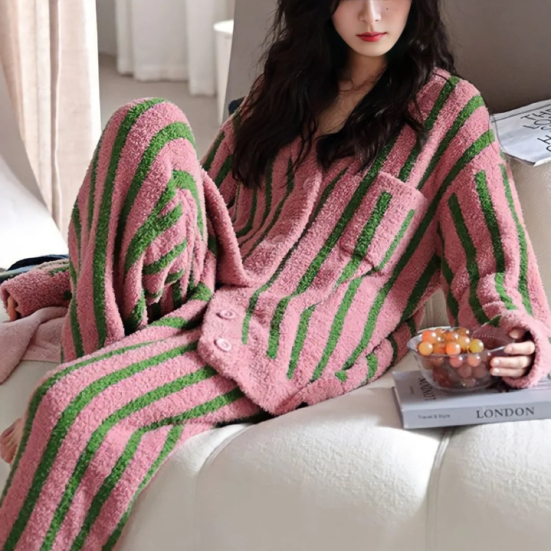 Full view of the relaxed-fit Bold Striped Fleece Pajama Set in a cozy living room setting - RoomDen