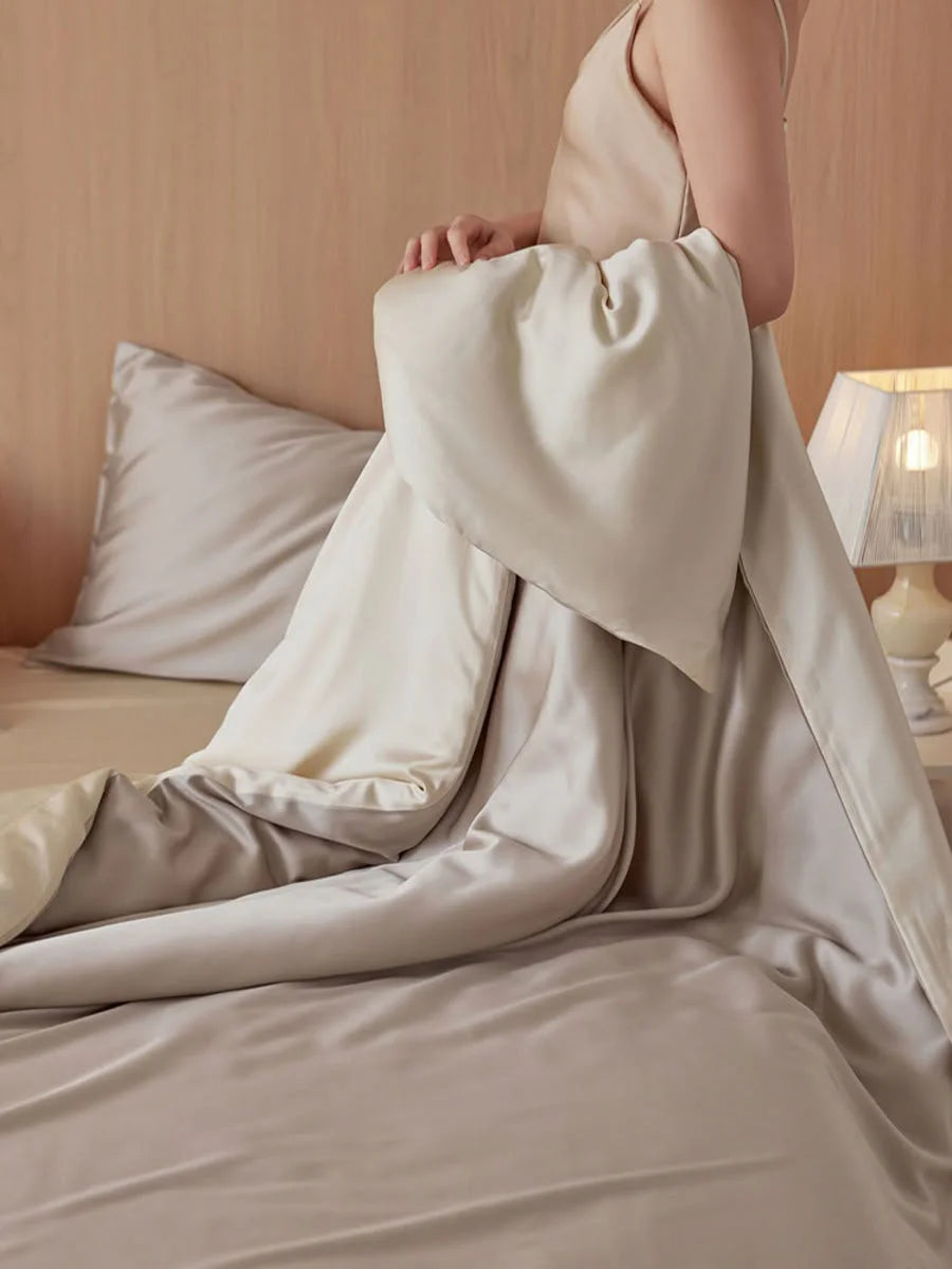 Detail shot of the elegant drape and sheen of the Oat Milk Tencel duvet cover. - RoomDen