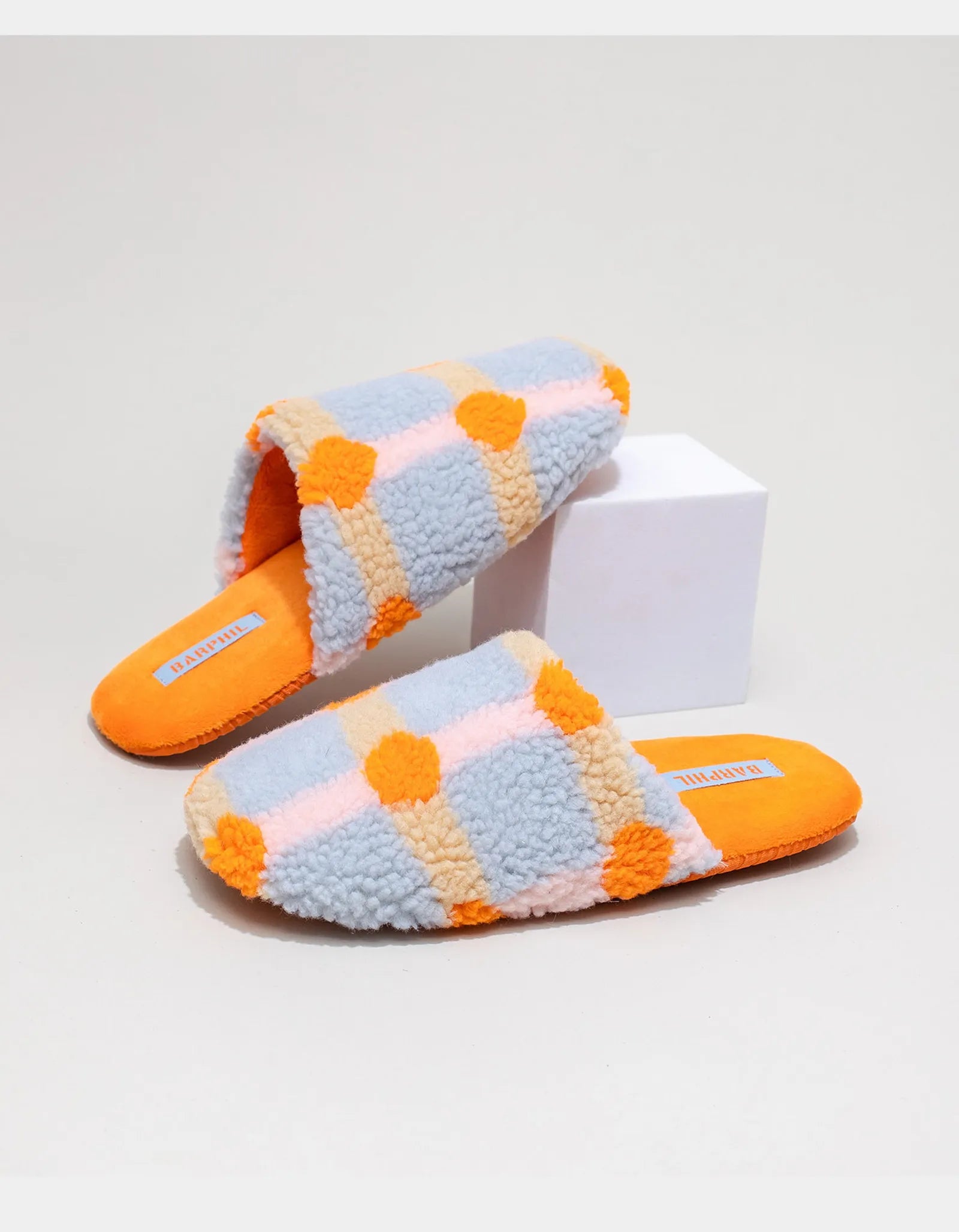 Side view of Orange and Blue Plaid Sherpa Slipper with bright orange sole - RoomDen