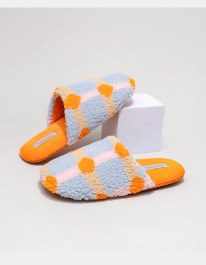Side view of Orange and Blue Plaid Sherpa Slipper with bright orange sole - RoomDen