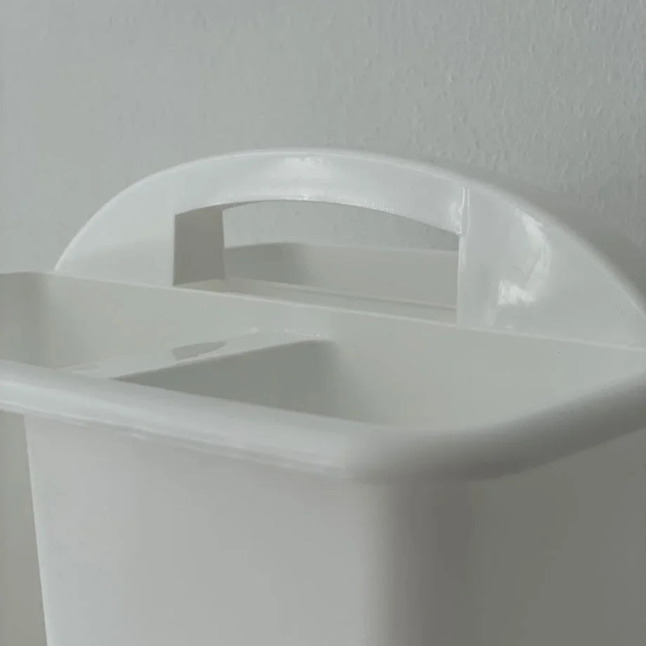 Close-up of the handle design on the white ABS organizer caddy. - RoomDen