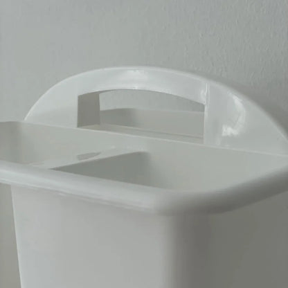 Close-up of the handle design on the white ABS organizer caddy. - RoomDen