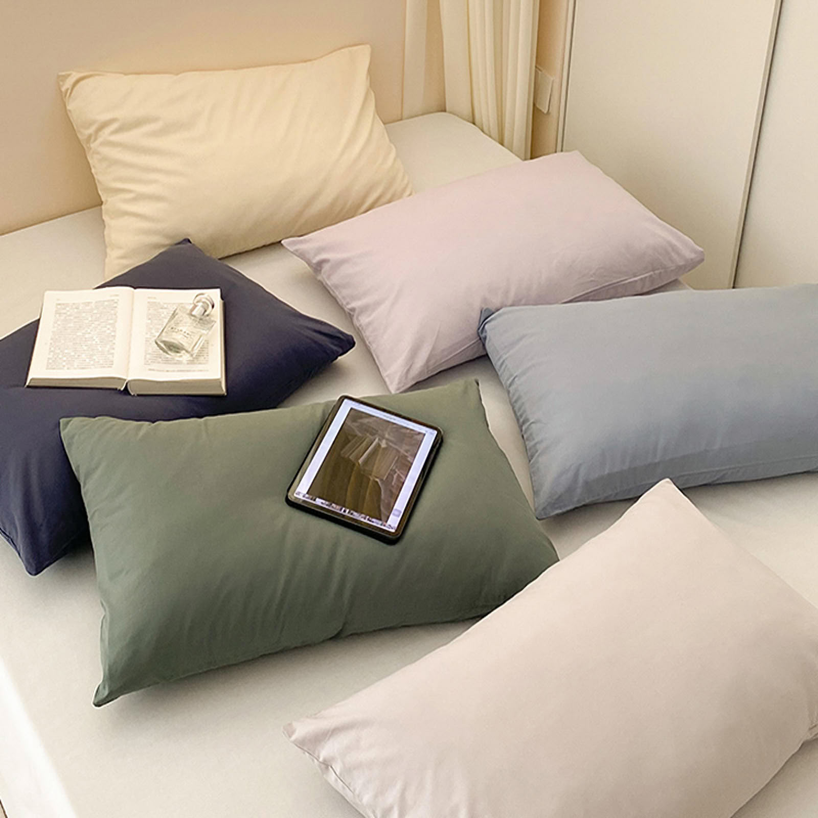 Soft washed cotton solid pillowcase in a minimalist cozy bedroom – RoomDen
