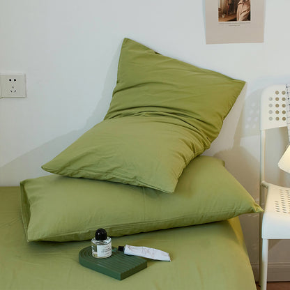 Soft washed cotton solid pillowcase in a minimalist cozy bedroom – RoomDen