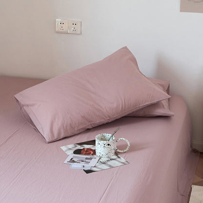 Soft washed cotton solid pillowcase in a minimalist cozy bedroom – RoomDen
