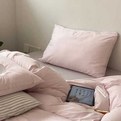 Soft washed cotton solid pillowcase in a minimalist cozy bedroom – RoomDen