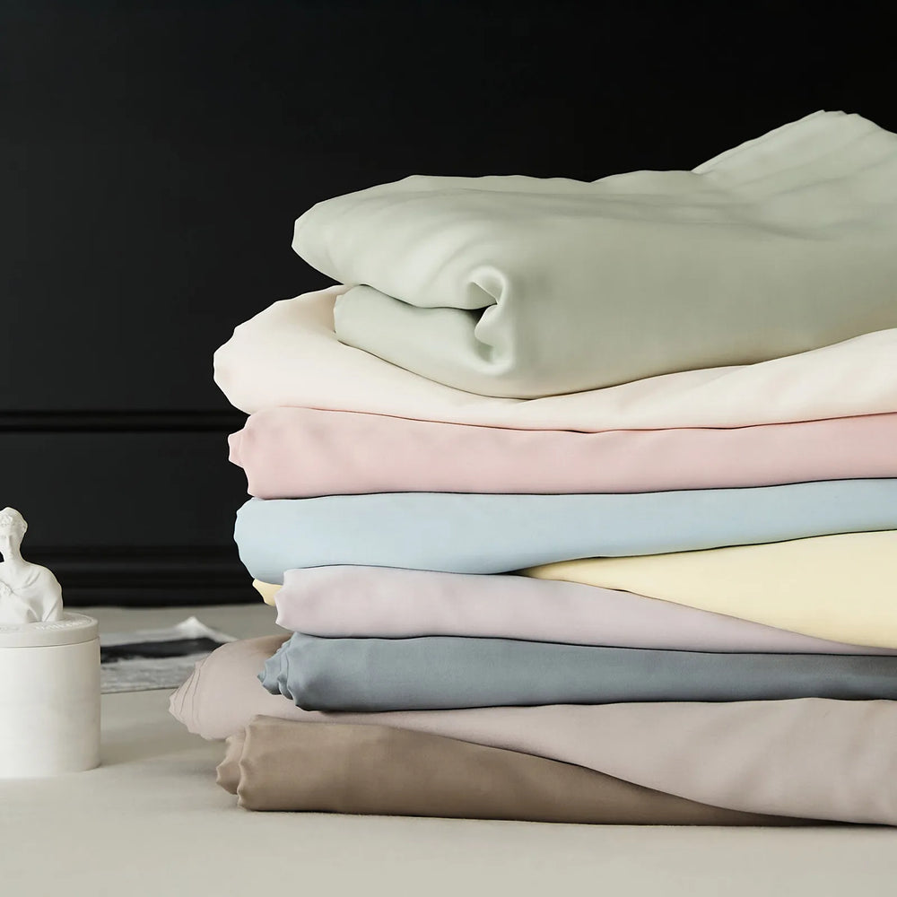 Cooling Tencel sheet set with silky smooth drape on a minimalist bed – RoomDen