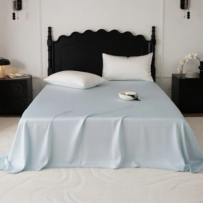 Cooling Tencel sheet set with silky smooth drape on a minimalist bed – RoomDen