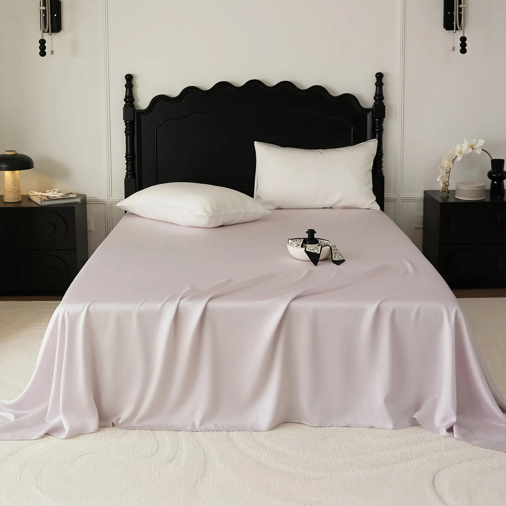 Cooling Tencel sheet set with silky smooth drape on a minimalist bed – RoomDen