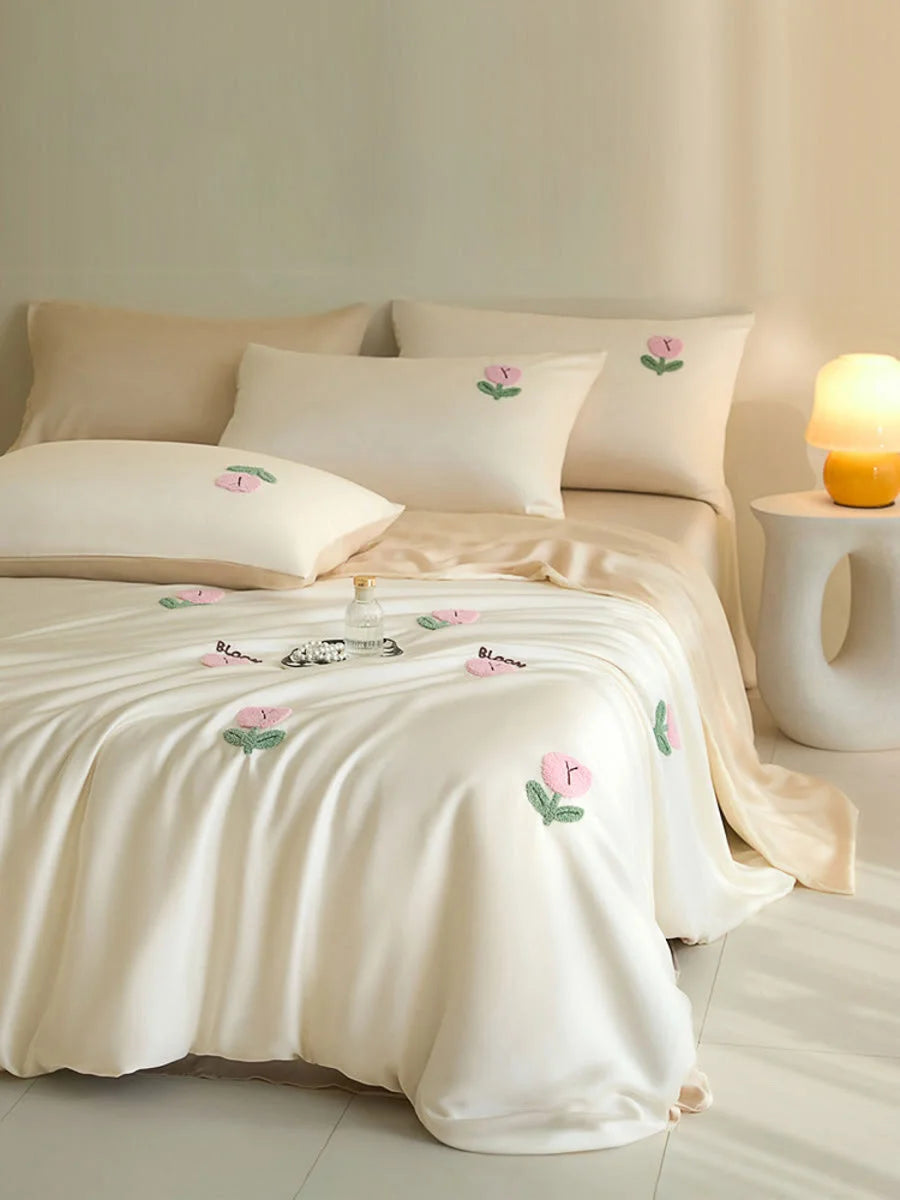Cream & Pink variant of the Tufted Doodle Flower Tencel Bedding Set on a bed in a warm-toned room. - RoomDen