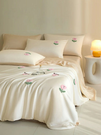 Cream & Pink variant of the Tufted Doodle Flower Tencel Bedding Set on a bed in a warm-toned room. - RoomDen