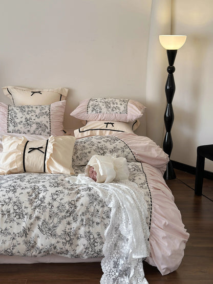 The Pink Toile bedding set styled with lace and a bouquet of roses, emphasizing the Coquette aesthetic. - RoomDen