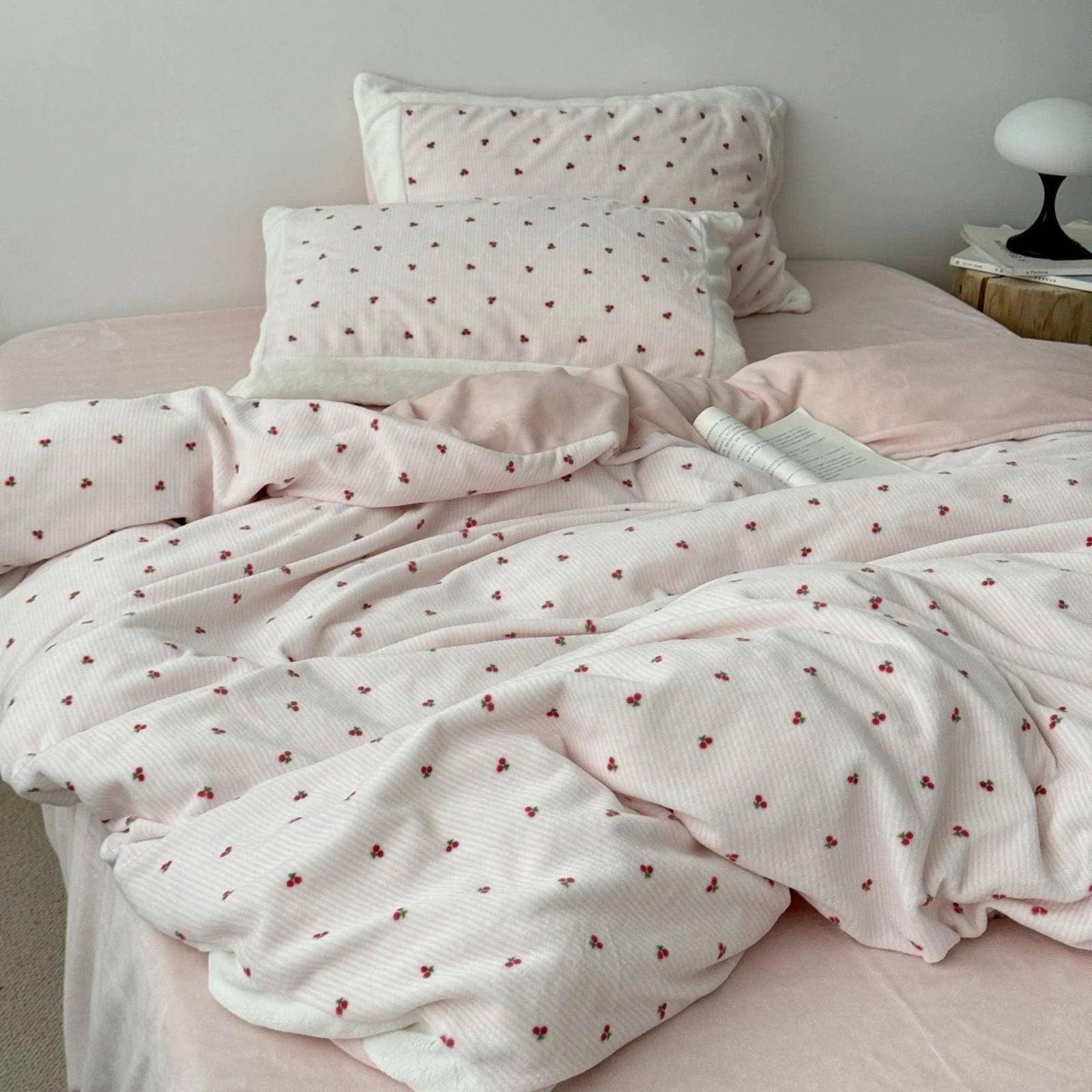 Full view of a bed made with the cozy cherry print flannel fleece duvet cover and pillowcases. - RoomDen