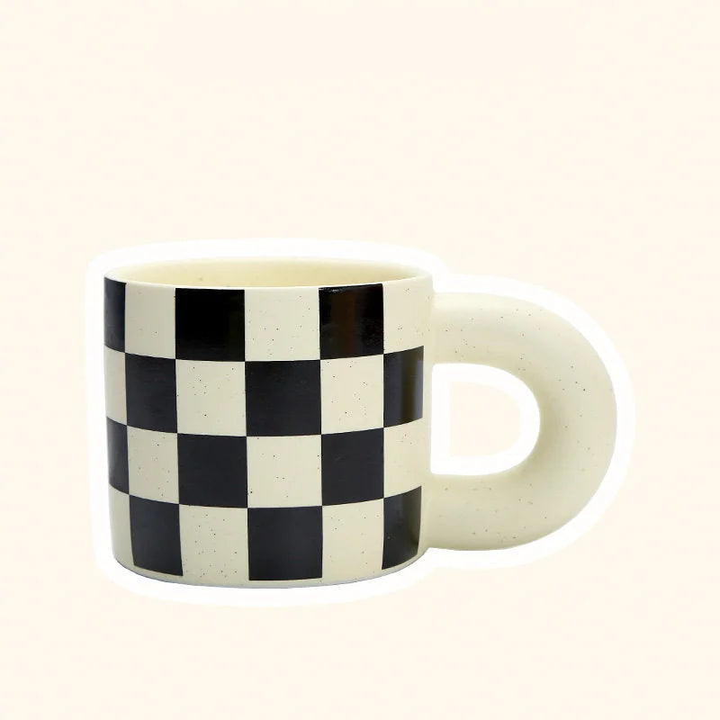 Front view of the Black Checkered Ceramic Mug with a Puffy Handle. - RoomDen