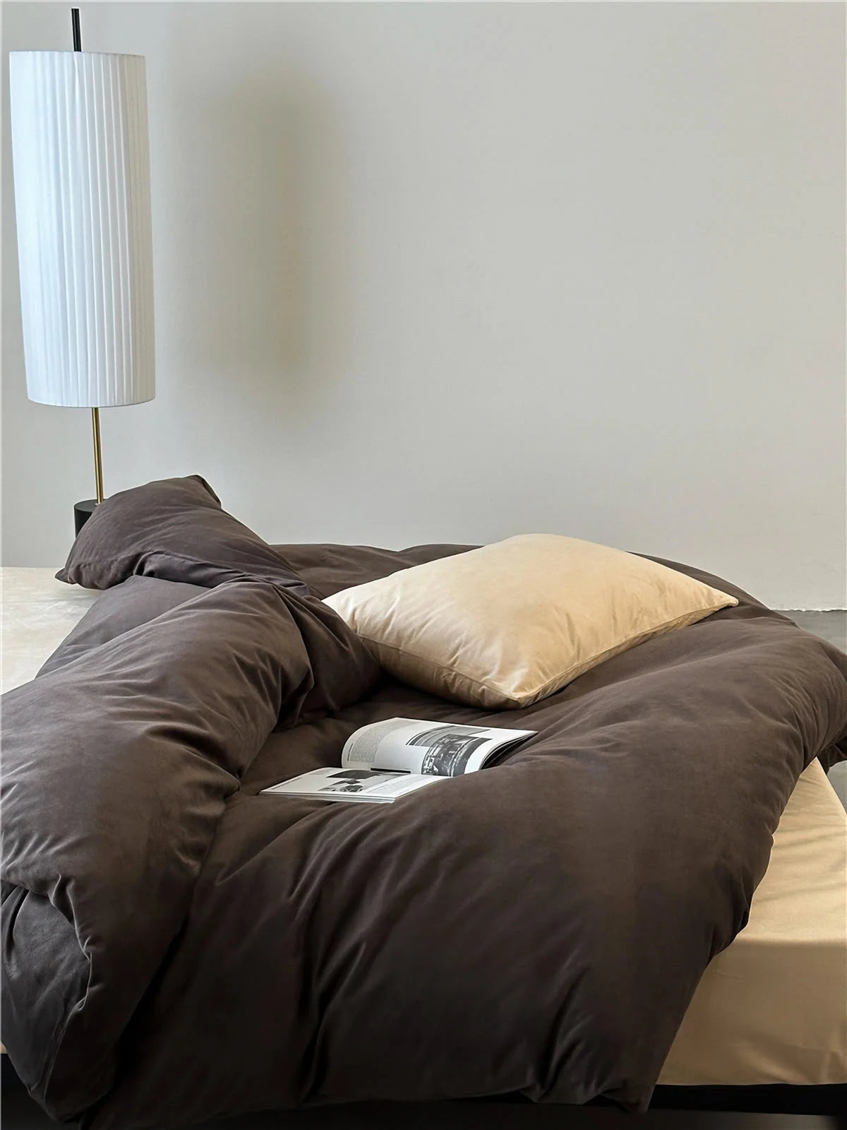 Overhead view showing the soft folds of the Mocha Brown velvet duvet cover with a cream pillow. - RoomDen