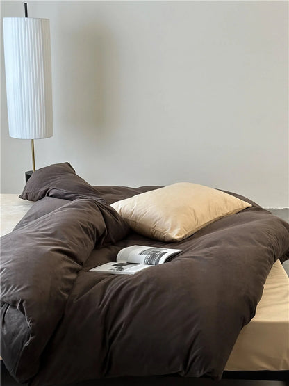 Overhead view showing the soft folds of the Mocha Brown velvet duvet cover with a cream pillow. - RoomDen