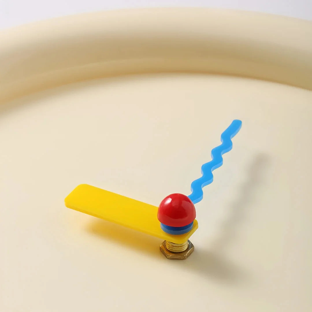Close-up of the playful colorblock hands on the Creamy Beige wall clock - RoomDen