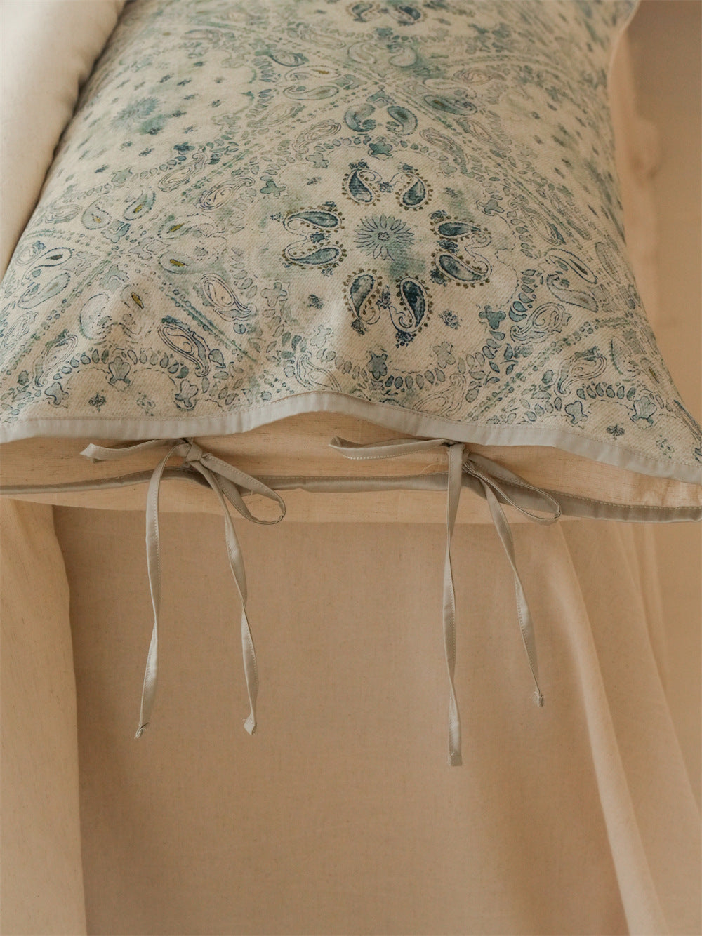 Stillgarden Blue Botanical Scroll Cotton Linen Bedding Set – Close-up of blue-green scrolls and pale pillow edging - Roomden
