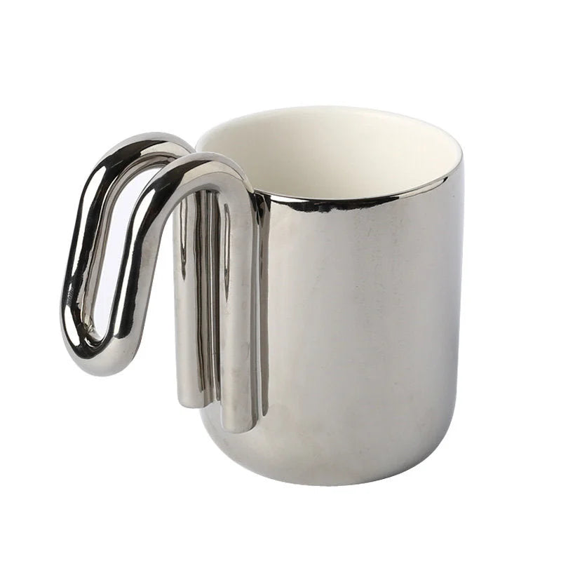 Chrome Silver ceramic mug with sculptural loop handle on a white background - RoomDen