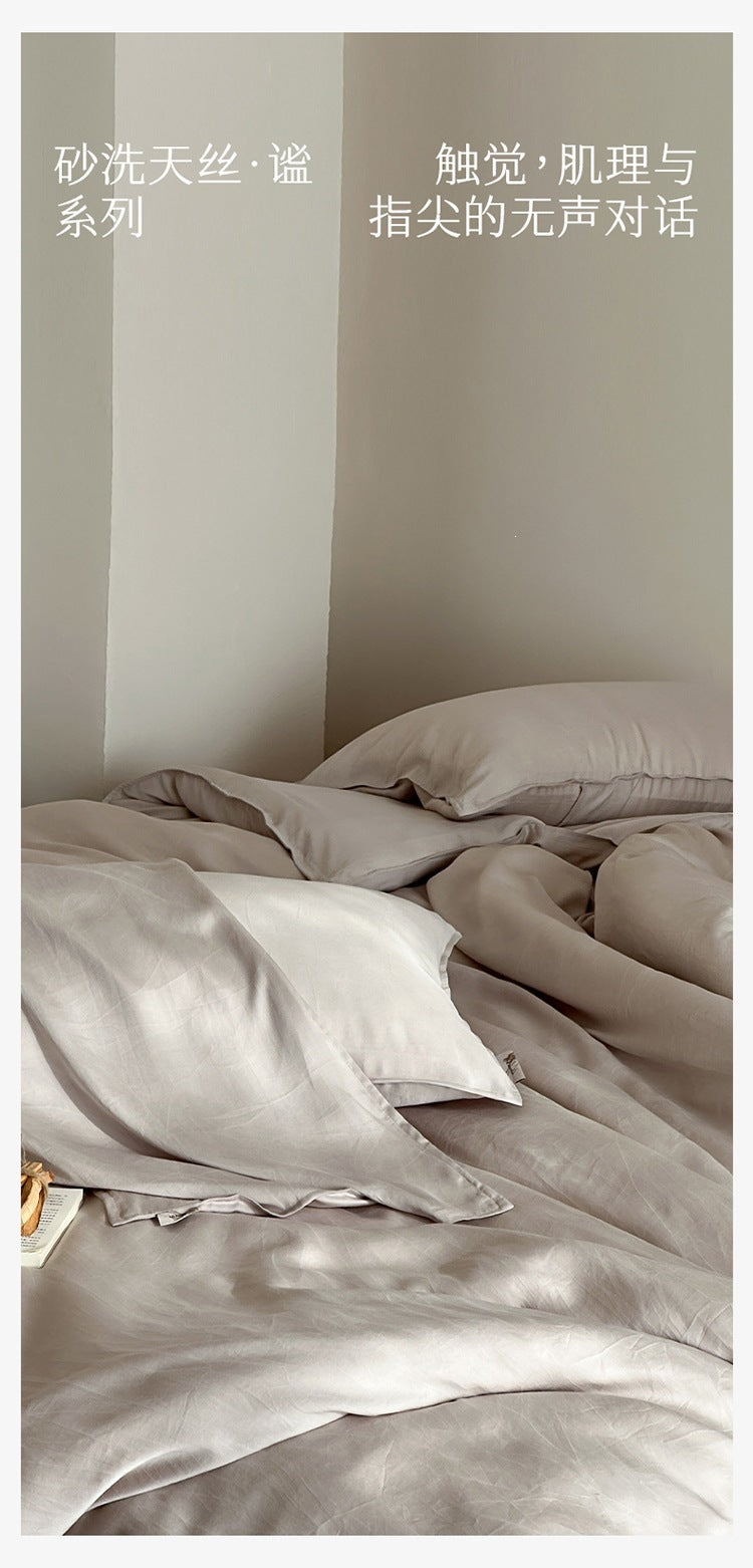 Washed lyocell bedding set – Morning Mist Grey, folded fabric display - Roomden