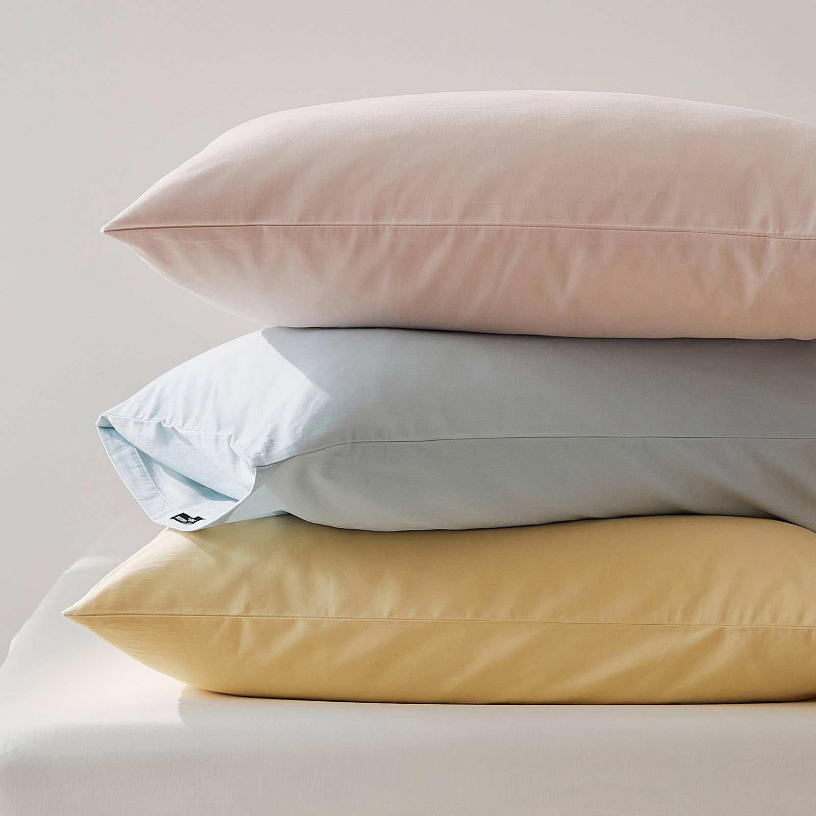 Muted solid washed cotton pillowcase in cozy minimalist style – RoomDen