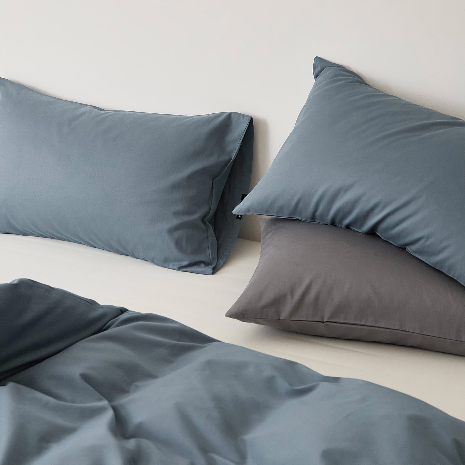 Muted solid washed cotton pillowcase in cozy minimalist style – RoomDen