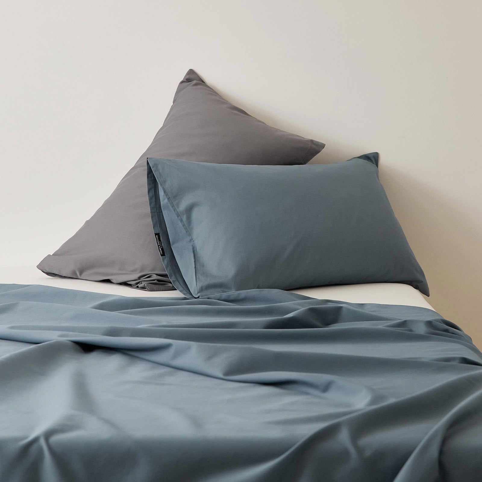 Muted solid washed cotton pillowcase in cozy minimalist style – RoomDen