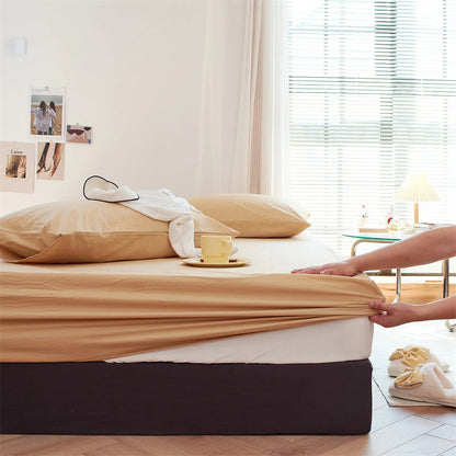 Solid washed cotton fitted sheet set in a minimalist bedroom – RoomDen