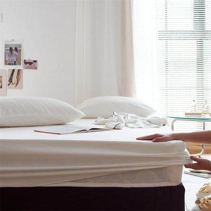 Solid washed cotton fitted sheet set in a minimalist bedroom – RoomDen